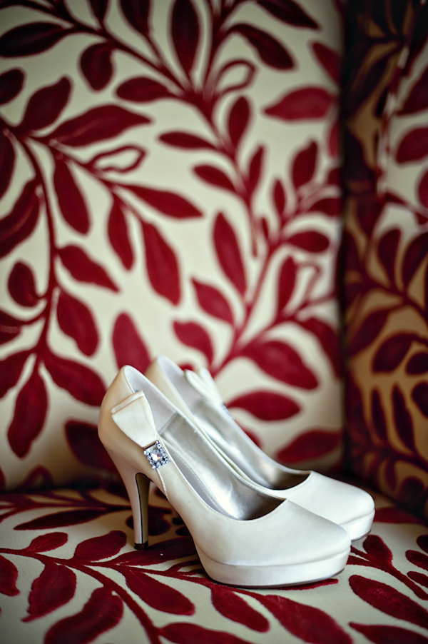 white wedding shoes on an ivory and red chair - wedding photo by top Atlanta based wedding photographers Scobey Photography